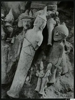 Several figurines in situ in excavation soil at Ayia Irini
