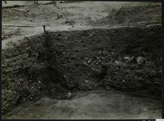 Section cross through soil layers and stones at the large water channel, Ayia Irini