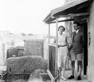 Einar and Vivi Gjerstad standing on a wooden veranda at Ayia Irini