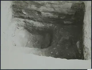 Tomb 3 at Enkomi during excavation: looking into a tomb chamber cut through layered soil