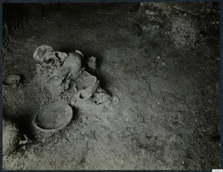 Tomb 13 at Enkomi during excavation, with vessels lying in the tomb chamber floor