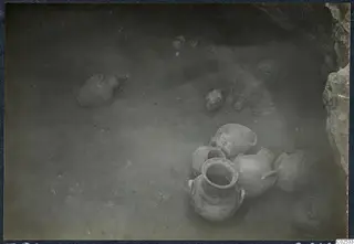 Pottery vessels and sherds lying on the floor of Tomb 98 at Marion, seen from above