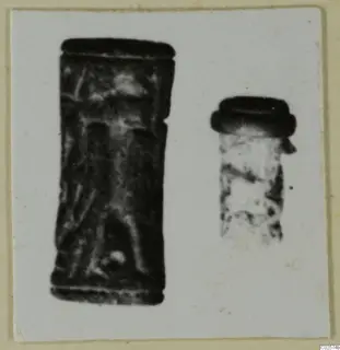 Two cylinder seals photographed side by side on a card, the larger one with engraved figures
