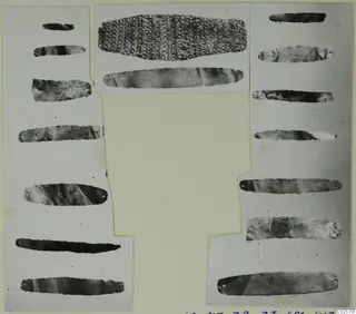 Gold and silver strips with small holes at their ends, mounted on a card, from the Enkomi finds