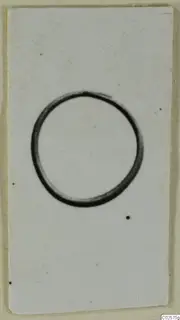 Single dark ring shape on a white card, filed as a find from Enkomi