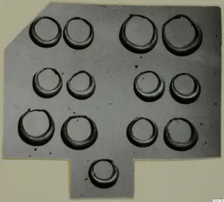 Group of hoop rings in rows, photographed on a card, from the Enkomi gold finds