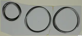 Three metal rings shown together on a pale grey background, Bronze Age gold and silver find from Enkomi