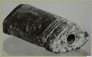Bone object from Enkomi with incised bands and a round hole in one rounded end