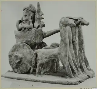 Terracotta model of a two-wheeled cart with seated figures and a team of animals, from Ayia Irini