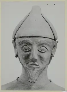Terracotta Proto-Cypriote I, head and upper body of a figure wearing a tall conical cap, seen from the front