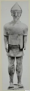 Standing terracotta figure with a pointed cap and beard, from Ayia Irini