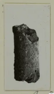 Find from Marion: a dark, rod-shaped object with a rough, broken upper end.