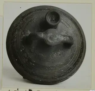 Levanto-Helladic bowl-jar seen from above, with a horizontal handle and a small spout on its dark surface