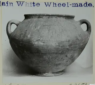 Plain White Wheel-made two-handled pot from Ayios Iakovos, shown from the side