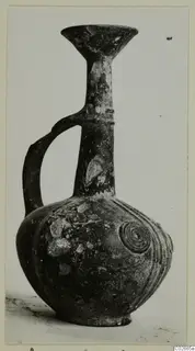 Pottery Base-Ring Ware jug with a trumpet-shaped mouth and a single loop handle