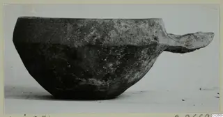 Pottery Monochrome Ware bowl with a flat side handle, from Ayios Iakovos