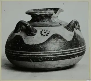 Pottery vessel with two handles, a flared rim and dark painted bands, from Ayios Iakovos