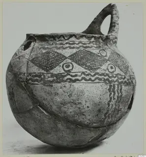 Pottery White Painted IV-V jug with a loop handle, painted wavy bands and diamond-lattice panels