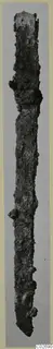 Long corroded iron knife from Marion, photographed upright against a grey background
