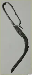 Corroded bronze toilet requisite from Marion, tombs 31–45, shown against a plain background