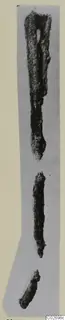 Three corroded iron tools from Marion Tomb 9, arranged in a vertical row