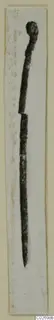 Bronze pin from Marion Tomb 9, broken across the shaft, shown upright on a pale card strip