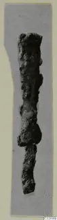 Corroded iron object in two broken pieces, photographed upright on a grey card mount