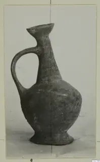 Pottery jug of Base-Ring Ware with a single loop handle and flared mouth, from Ayios Iakovos