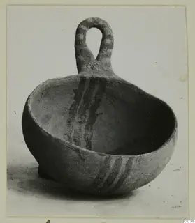 White Painted IV-V bowl with a loop handle from Ayios Iakovos