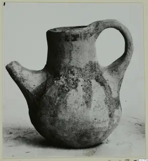 Pottery jug with a side spout and loop handle, White Painted IV-V, shown on a plain background.