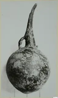 Red Polished II jug from Lapithos, Vrysi tou Barba tombs, with a tall neck and single loop handle