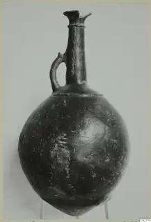Red Polished II jug with a single loop handle, from the Vrysi tou Barba tombs at Lapithos