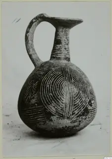 Red Polished II jug from Lapithos with incised arcs, chevrons and horizontal lines on its body