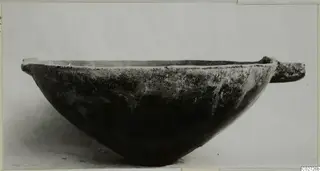 Red Polished III bowl with a horizontal handle, seen from the side against a plain light background