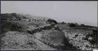 View from the Mersinaki excavation across a rocky slope and hills towards the sea