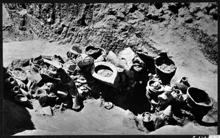 Finds in situ in pit H 14-15 at Mersinaki, with large vessels and small figurines in excavated soil