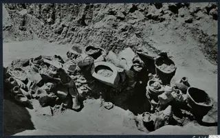 Finds in situ in pit H 14-15 at Mersinaki, with jars, bowls and a jug set among earth in a dug pit