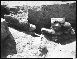 Objects found in situ in Pit II at Mersinaki, lying among stones at the base of an excavated trench.