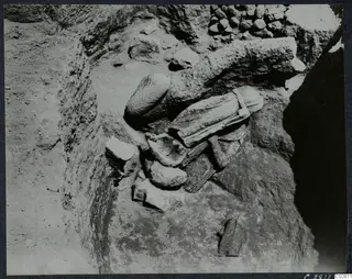 Objects found in situ at Mersinaki in Pit II: broken stone pieces lying in an excavated pit