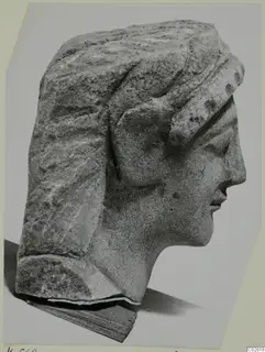 Limestone head from Kition in profile facing right, with a wide band over the hair