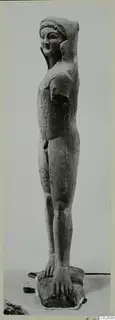 Limestone statue of a standing nude figure from Kition, with a damaged head and arm