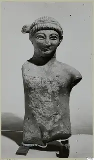 Limestone statue of a male figure from Kition, head and upper body, arms and legs broken off