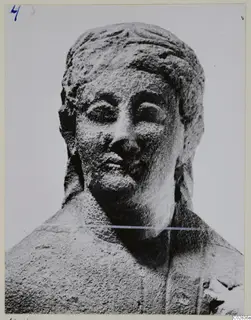 Limestone sculpture of a head and upper shoulders from Kition, in close view