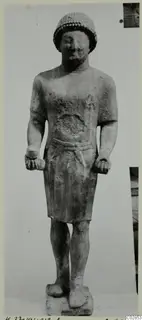 Limestone statue of a standing male figure from Kition, shown full length