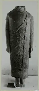 Headless limestone statue from Kition in a long garment with diagonal bands of incised pattern
