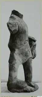 Headless limestone statue of a standing figure from Kition, seen from the side