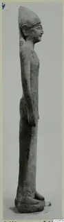 Limestone statuette of a standing male figure in side profile, facing right, from Kition.