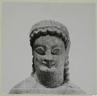 Limestone sculpture of a head and shoulders from Kition, seen from the front