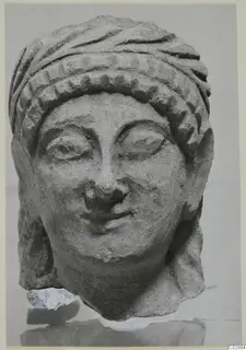 Limestone head with a patterned headdress, from Kition