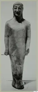 Limestone Cypro-Greek I statue of a standing male figure, seen from the front.